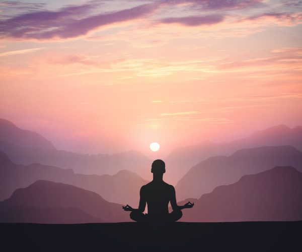 man-practices-yoga-meditates-mountain-sunset (1)